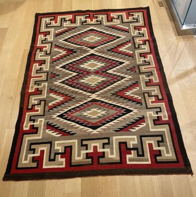 Navajo Dine Regional rug with eyedazzler design in the center