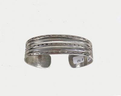 Navajo bracelet with eagles arrows and 2 whirling logs