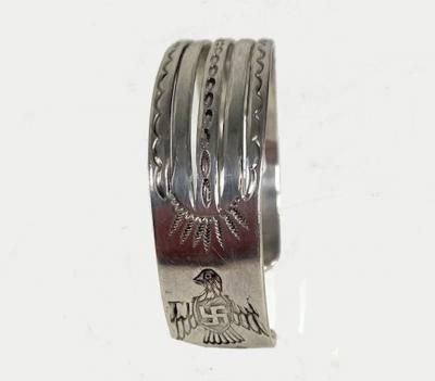 Navajo bracelet with eagles arrows and 2 whirling logs
