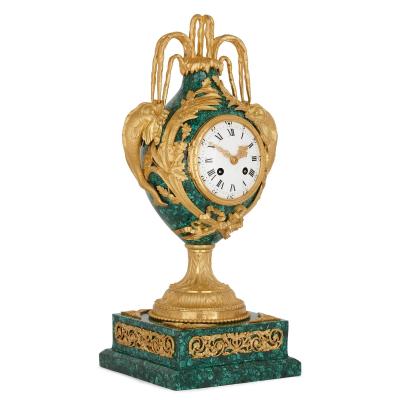 Neoclassical style gilt bronze and malachite mantel clock
