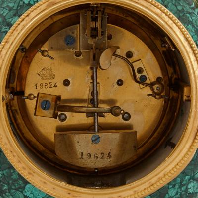 Neoclassical style gilt bronze and malachite mantel clock
