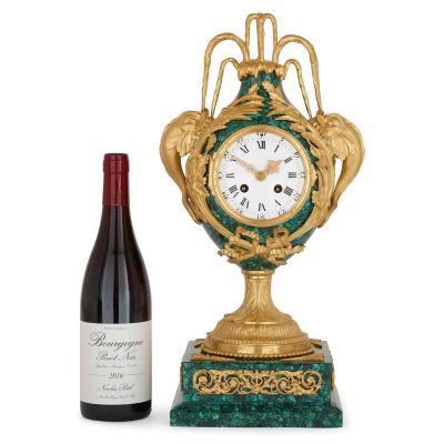 Neoclassical style gilt bronze and malachite mantel clock