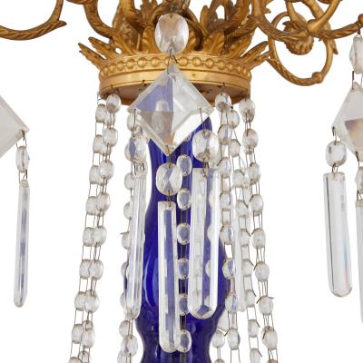 Neoclassical style gilt bronze clear and blue cut glass chandelier