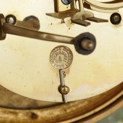 Neoclassical style gilt bronze mounted glass and marble mantel clock