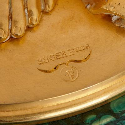 Neoclassical style malachite silvered and gilt bronze clock set