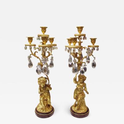 Nice pair of 1860 girandoles in gilded bronze with crystal pendants