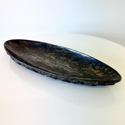 Oblong centerpiece with ring patterned underside in gold and silver glaze