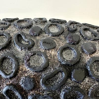 Oblong centerpiece with ring patterned underside in gold and silver glaze