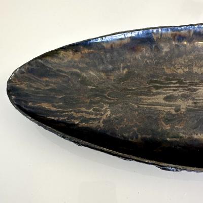 Oblong centerpiece with ring patterned underside in gold and silver glaze