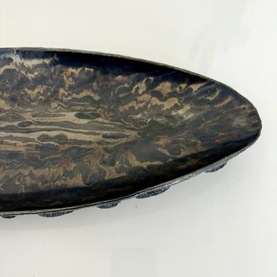 Oblong centerpiece with ring patterned underside in gold and silver glaze