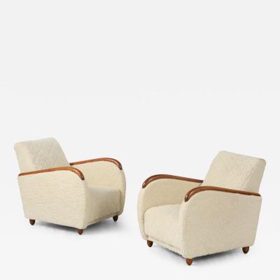 Osvaldo Borsani Osvaldo Borsani Pair of Sheepskin and Oak Lounge Chairs circa 1945