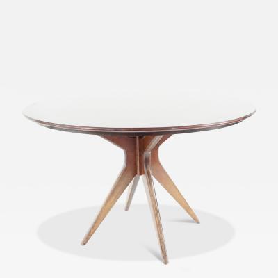 Osvaldo Borsani Osvaldo Borsani round dining table walnut four feet circa 1951