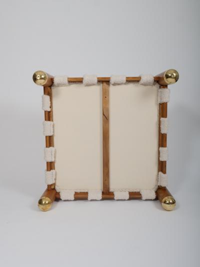 Ottoman in wool boucle wood and brass