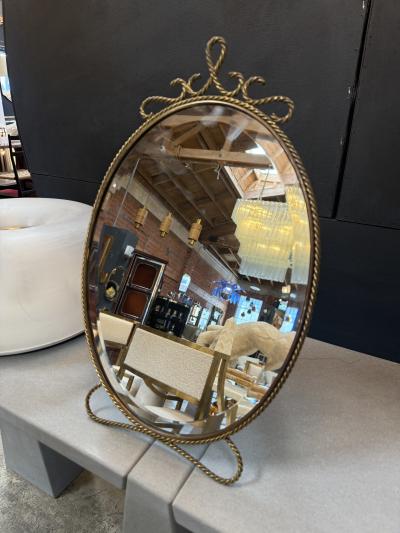 Oval Brass Vanity Mirror with Decorative Frame