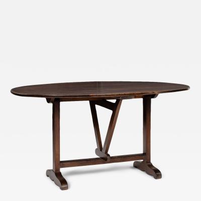 Oval Tilt Top Walnut Table