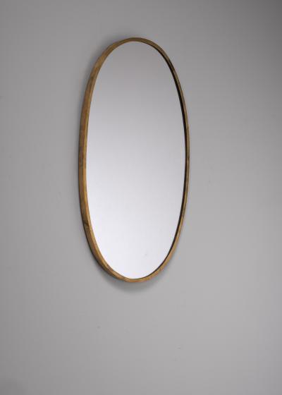 Oval brass wall mirror