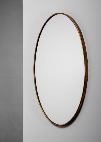 Oval brass wall mirror