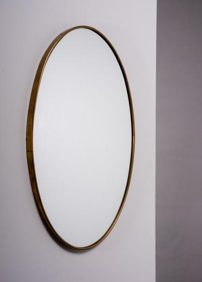 Oval brass wall mirror Italy
