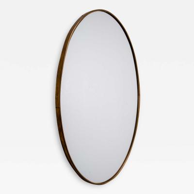 Oval brass wall mirror Italy