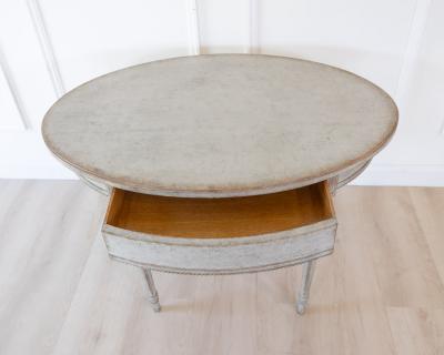 Oval table in the Gustavian style is finished in grey
