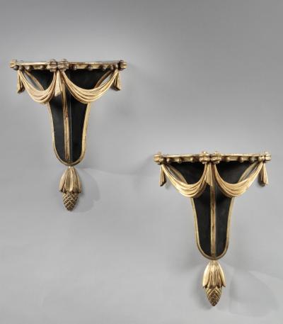 PAIR OF CARVED EBONIZED AND GILDED BRACKETS