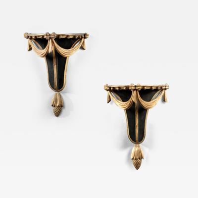 PAIR OF CARVED EBONIZED AND GILDED BRACKETS