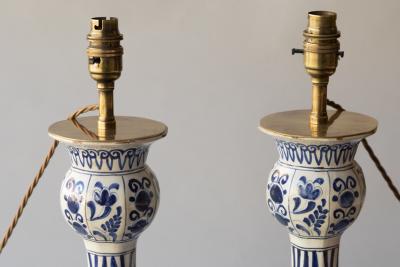 PAIR OF DUTCH DELFT BLUE AND WHITE WAISTED BOTTLE VASES CONVERTED TO LAMPS