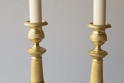PAIR OF EARLY 19TH CENTURY GILT BRONZE CANDLESTICKS CONVERTED TO TABLE LAMPS