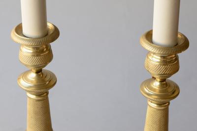 PAIR OF EARLY 19TH CENTURY GILT BRONZE CANDLESTICKS CONVERTED TO TABLE LAMPS