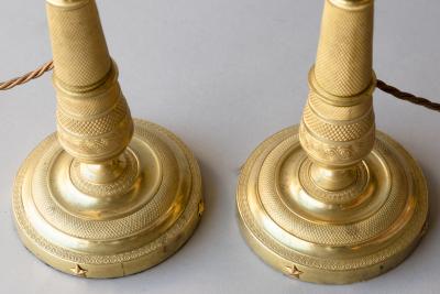 PAIR OF EARLY 19TH CENTURY GILT BRONZE CANDLESTICKS CONVERTED TO TABLE LAMPS