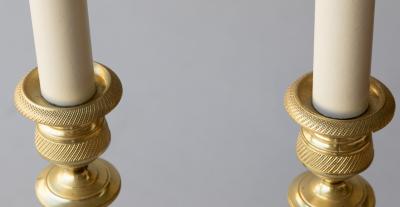 PAIR OF EARLY 19TH CENTURY GILT BRONZE CANDLESTICKS CONVERTED TO TABLE LAMPS