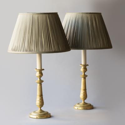 PAIR OF EARLY 19TH CENTURY GILT BRONZE CANDLESTICKS CONVERTED TO TABLE LAMPS