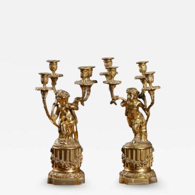 PAIR OF FRENCH DOR BRONZE CHERUB CANDELABRAS