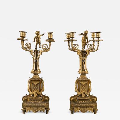 PAIR OF FRENCH ORMOLU CANDELABRAS WITH CHERUB ON TOP