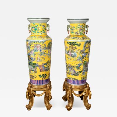 PAIR OF LARGE CHINESE YELLOW GROUND FAMILLE ROSE PALACE VASES
