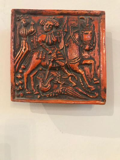 PAIR OF PAINTED DUTCH MEDIEVAL STYLE GLAZED TERRACOTTA RELIEFS PLAQUES