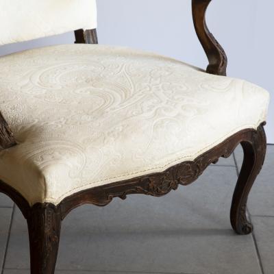 PAIR OF R GENCE PERIOD CARVED AND STAINED BEECH FAUTEUILS