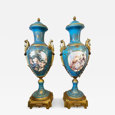 PAIR OF SEVRES STYLE ORMOLU MOUNTED PORCELAIN LIDDED VASES 20TH CENTURY