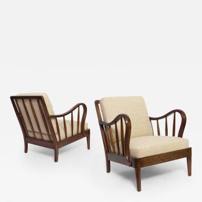 PAIR OF SWEDISH LOUNGE CHAIRS MADE OF STAINED ELM WOOD CIRCA 1940 S