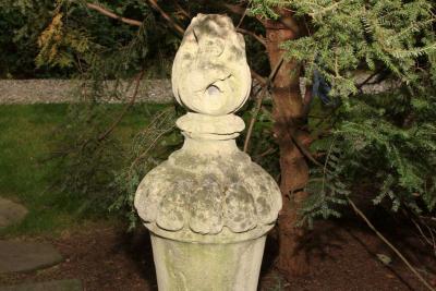 PAIR OF TALL CARVED STONE FLAME FINIALS
