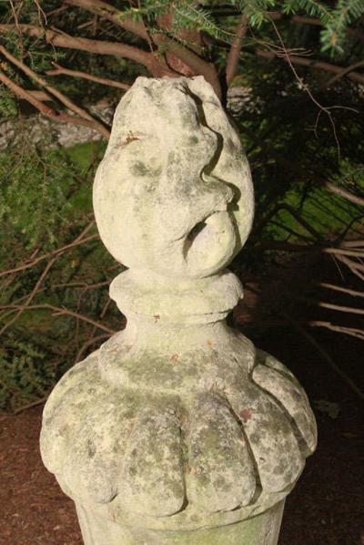 PAIR OF TALL CARVED STONE FLAME FINIALS