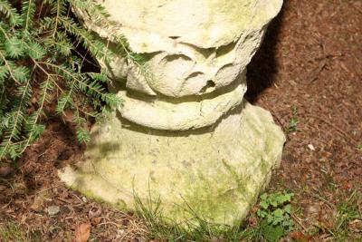 PAIR OF TALL CARVED STONE FLAME FINIALS