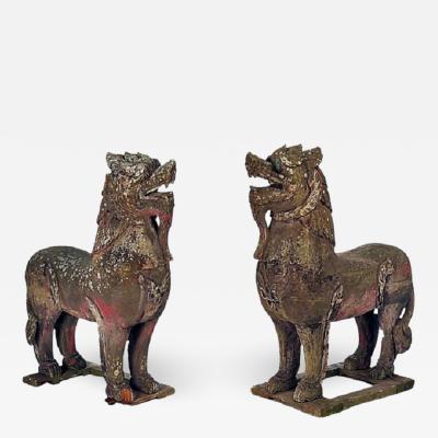 PAIR OF WOOD PALACE LIONS S E ASIA WEATHERED WITH MICA EYES