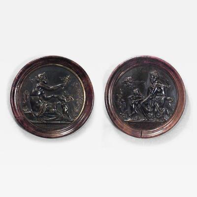 PAIR of French Victorian round walnut framed bronze wall plaques