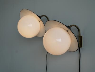 Paavo Tynell A pair of indoor outdoor wall lights by Paavo Tynell for Taito