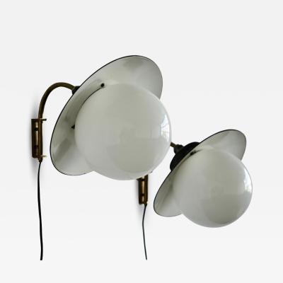 Paavo Tynell A pair of indoor outdoor wall lights by Paavo Tynell for Taito