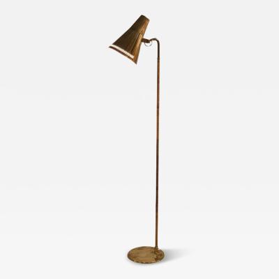 Paavo Tynell Paavo Tynell Floor Lamp Model K10 9 9628 in Brass and Rattan Idman 1950s