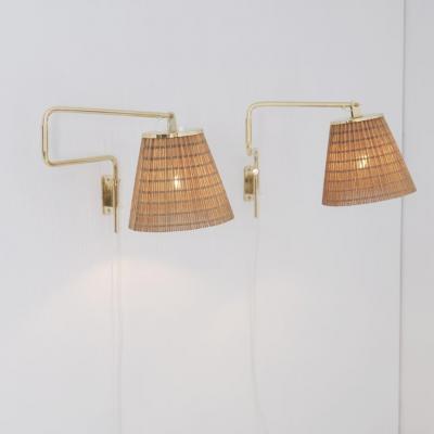 Paavo Tynell Pair of Paavo Tynell Adjustable Rattan Shade Wall Lights Model 9414 Taito 1950s