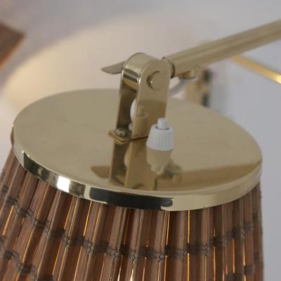 Paavo Tynell Pair of Paavo Tynell Adjustable Rattan Shade Wall Lights Model 9414 Taito 1950s