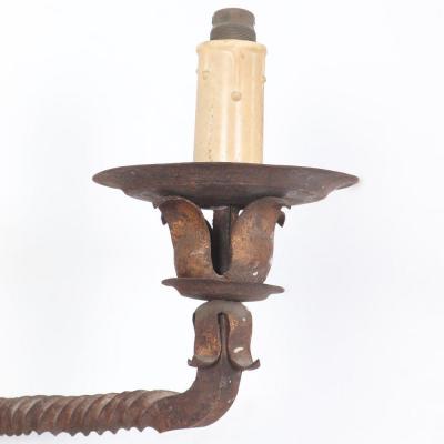 Pair French iron two arm wall sconces with old traces of gold circa 1910 